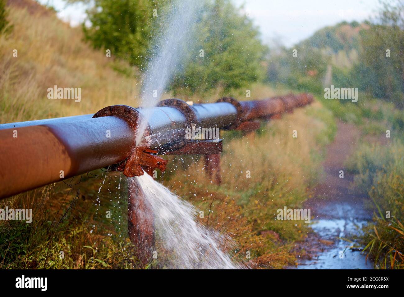 pipeline burst water pours from pipes industrial... Industrial pipe break hi-res stock photography and images - Alamy