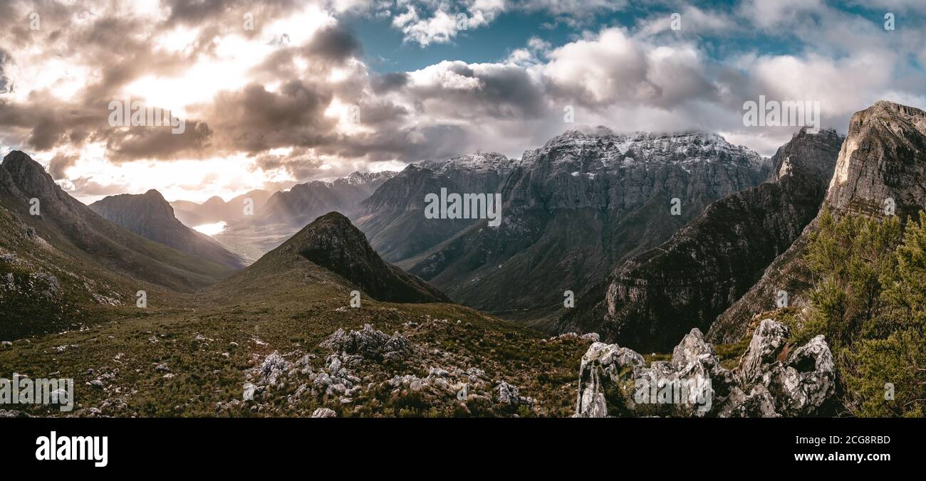 Stunning view of mountain tops sprinkled with snow during golden hour, Mont Rochelle Nature Reserve, Franschhoek Stock Photo