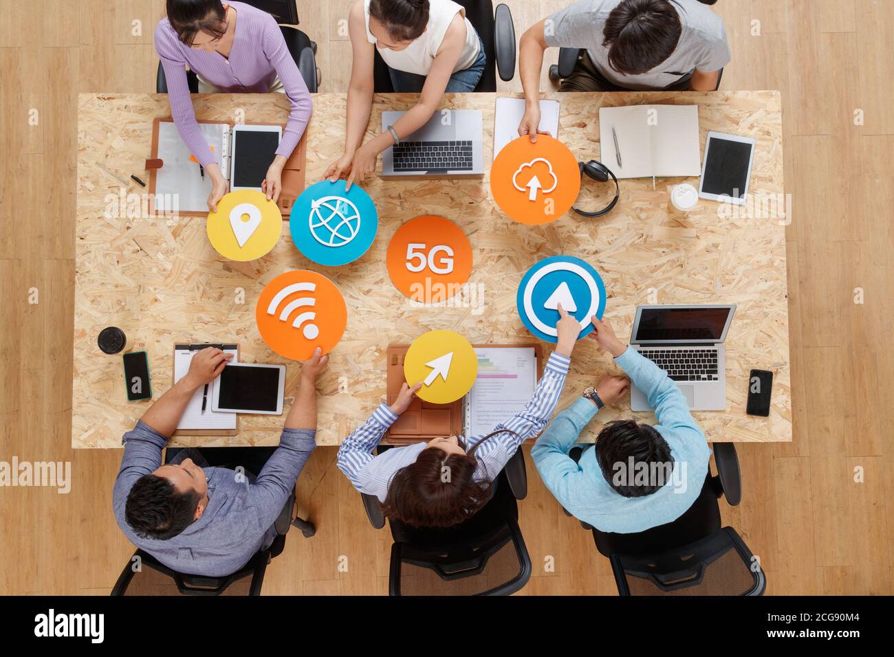Office workers face to face with symbolic ICONS Stock Photo