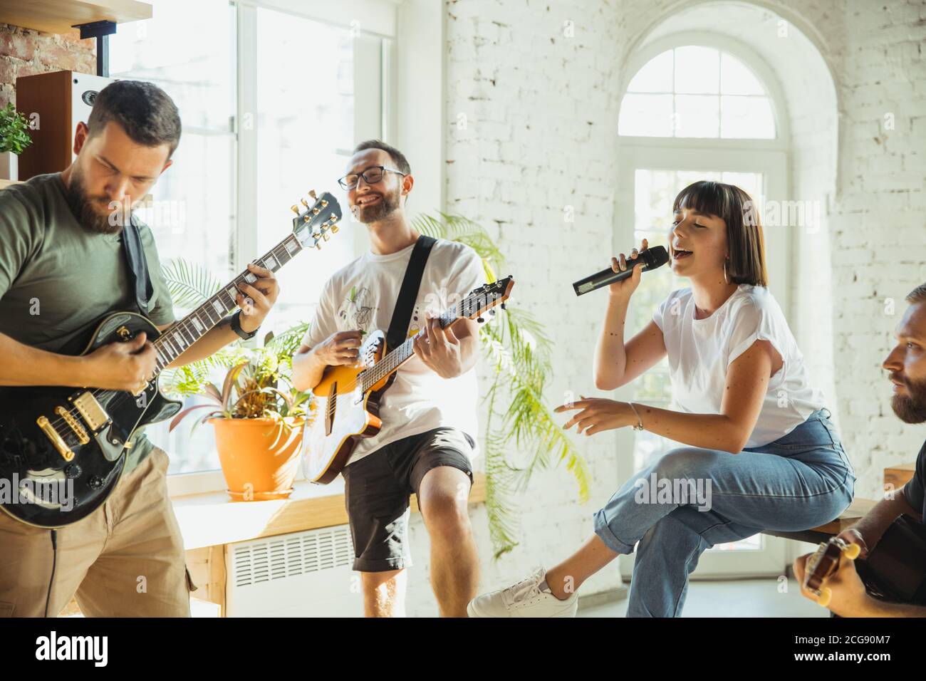 Rhythm. Musician band jamming together in art workplace with