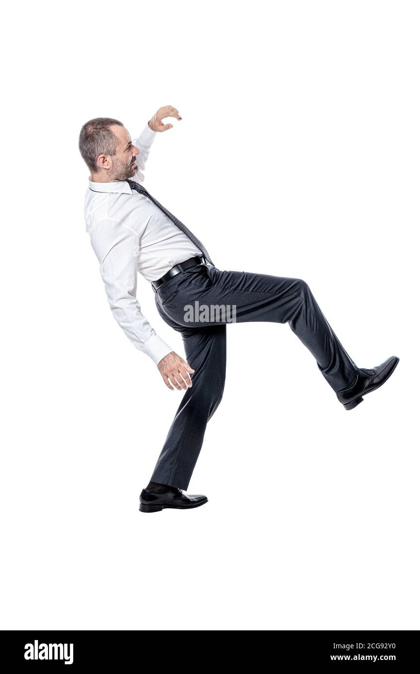 businessman losing his balance. isolated on white Stock Photo Alamy
