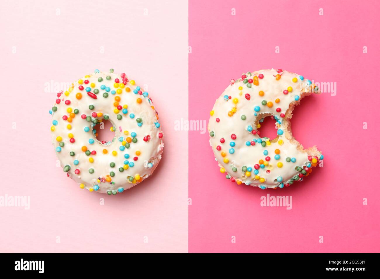 Two tasty donuts on two tone background Stock Photo