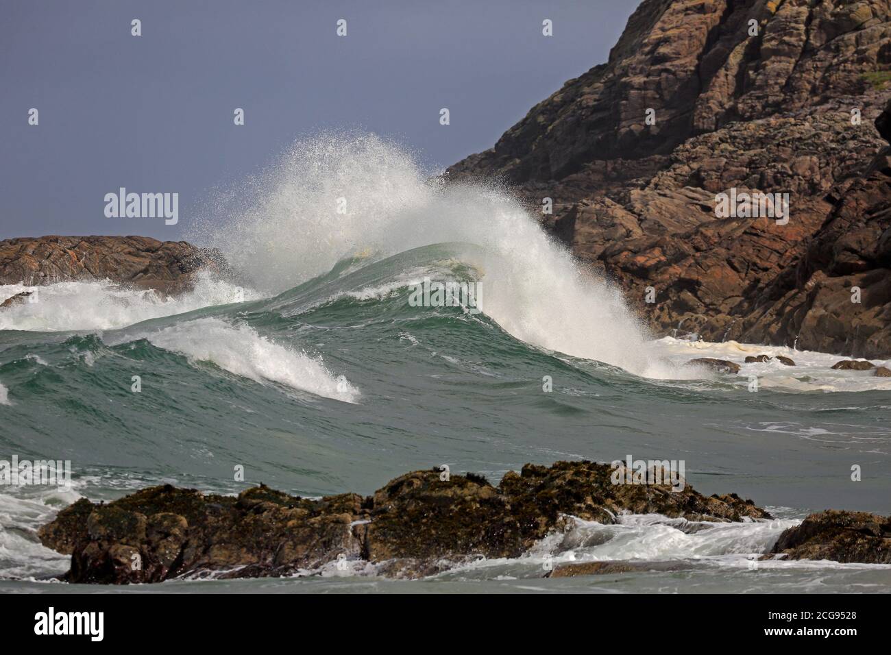 Large storm waves crashing onto rocks in Craimneach Bay Isle of Coll Inner Hebrides, Scotland Stock Photo