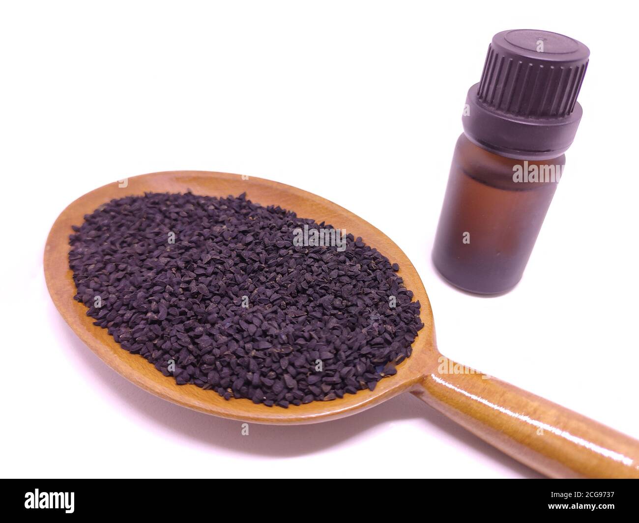 Glass bottle of black cumin seeds essential oil , Nigella Sativa in ...