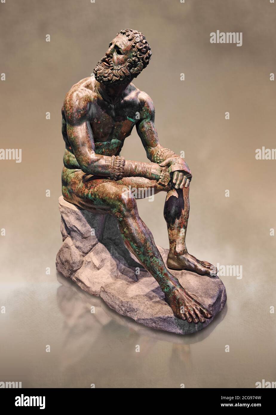 Rare original Greek bronze statue of an Athlete after a boxing match, a 1st cent BC. The athlete, seated on a boulder, is resting after a boxing match Stock Photo