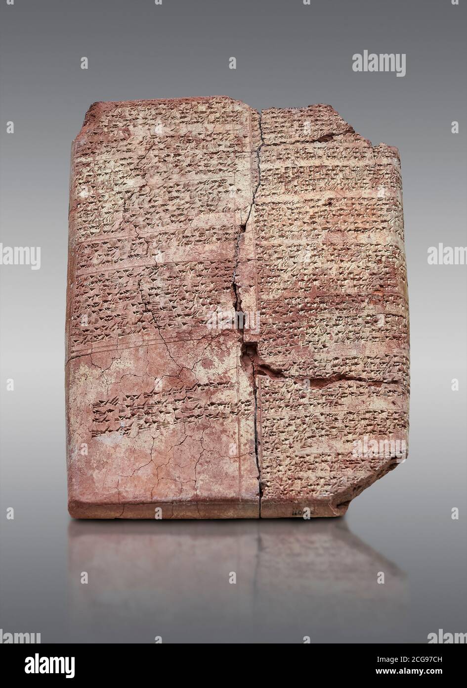Hittite cuneiform clay tablet,  Hattusa, Hittite  Kingdom 1600-1200 BC, Bogazkale archaeological Museum, Turkey.  Grey background Stock Photo