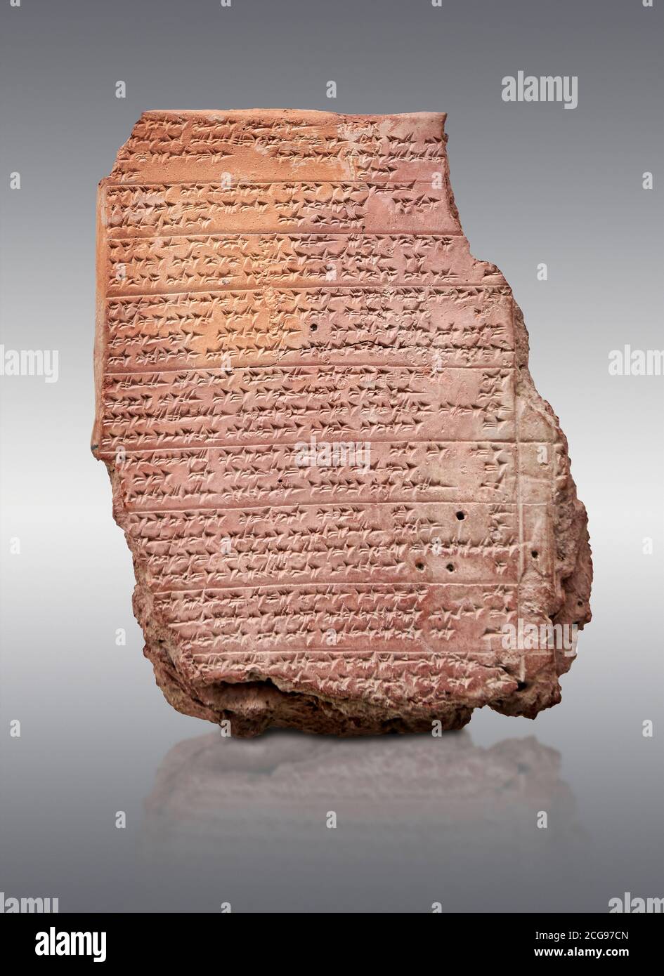 Hittite cuneiform clay tablet,  Hattusa, Hittite  Kingdom 1600-1200 BC, Bogazkale archaeological Museum, Turkey.  Grey background Stock Photo