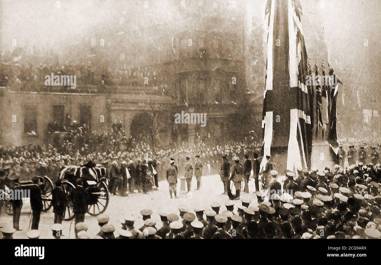 Unveiling the cenotaph, London, on Armistice Day 1920. The coffin of the unknown warrior is on the gun carriage ready for transportation to Westminster Abbey where the body was laid to rest.On the morning of 11 November 1920, the casket was placed onto a gun carriage of the Royal Horse Artillery  and pulled through the city by six horses through numerous silent crowds. The cenotaph in the UK that stands in Whitehall, London, was designed by Sir Edwin Lutyens to replace an  identical wood and plaster cenotaph erected in 1919 for the Allied Victory Parade. It's a Grade I listed building . Stock Photo