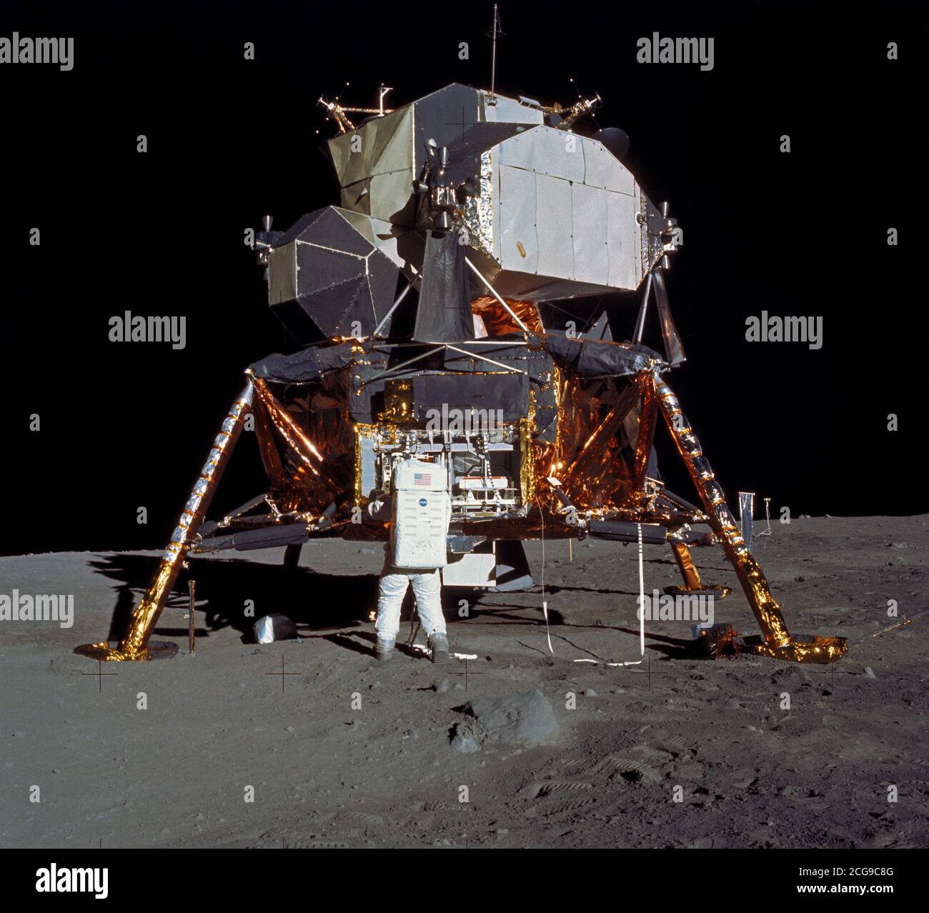 (20 July 1969) --- Astronaut Edwin E. Aldrin Jr., lunar module pilot, prepares to deploy the Early Apollo Scientific Experiments Package (EASEP) during the Apollo 11 lunar surface extravehicular activity (EVA). Stock Photo