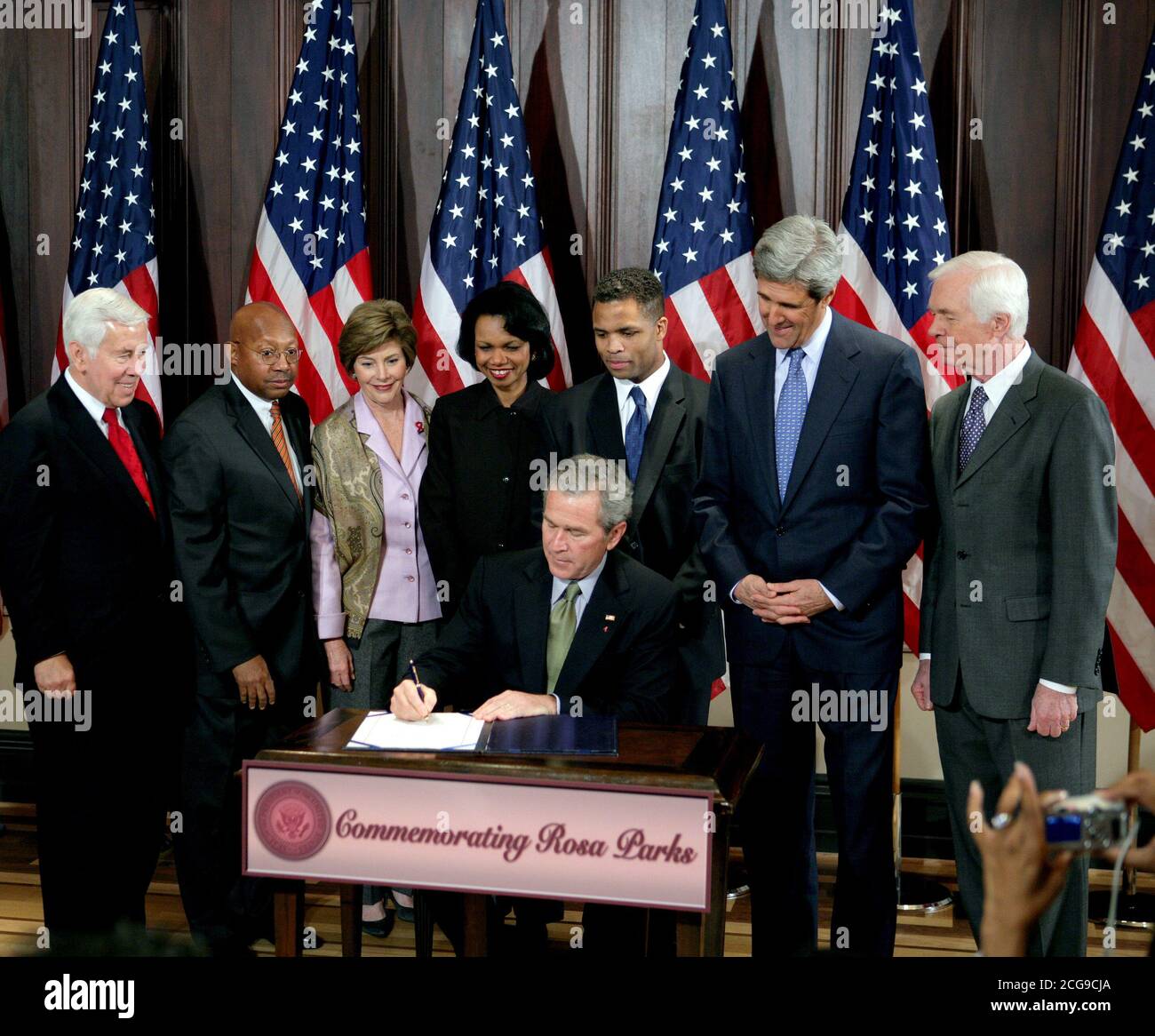 President George W. Bush is seen Thursday, Dec. 1. 2005 in the Eisenhower Executuive Office Building in Washington, as he signs H.R. 4145, to Direct the Joint Committee on the Library to Obtain a Statue of Rosa Parks, which will be placed in the US Capitol's National Statuary Hall. The President is joined by, from left to right, U.S. Sen. Richard G. Lugar, R-Ind., U.S. Secretary of Housing and Urban Development Alphonso Jackson, Mrs. Laura Bush, U.S. Secretary of State Condoleezza Rice, U.S. Rep. Jesse Jackson Jr., D-Ill., U.S. Sen. John Kerry, D-Mass., and U.S. Sen. Thad Cochran, R-Miss. Stock Photo