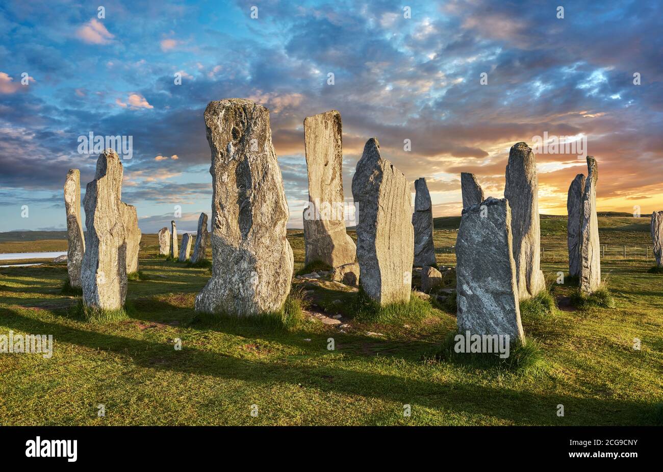 Calanais Standing Stones central stone circle, at sunset, erected between 2900-2600BC measuring 11 metres wide. At the centre of the ring stands a hug Stock Photo