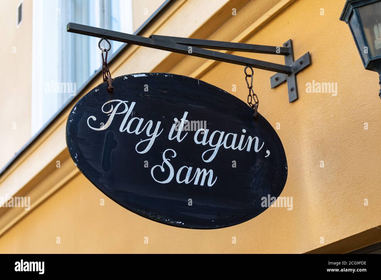 Play it again, Sam. Hanging sign over vintage and second-hand clothing shop entrance in Kruununhaka district of Helsinki, Finland. Stock Photo