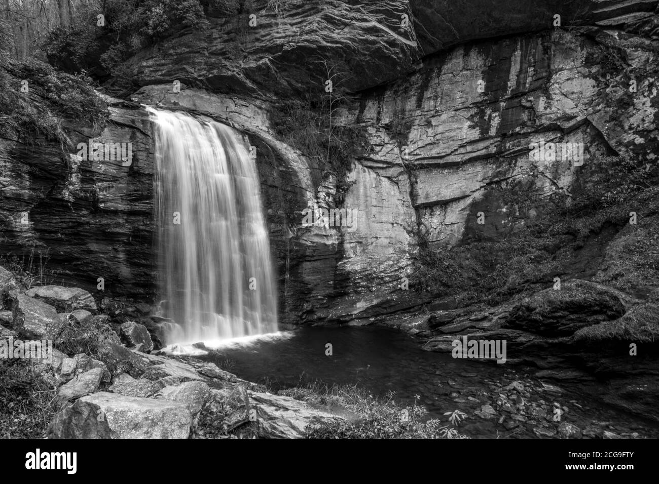 Black and white image of  water flowing over Looking Glass Falls near Brevard, NC. Stock Photo