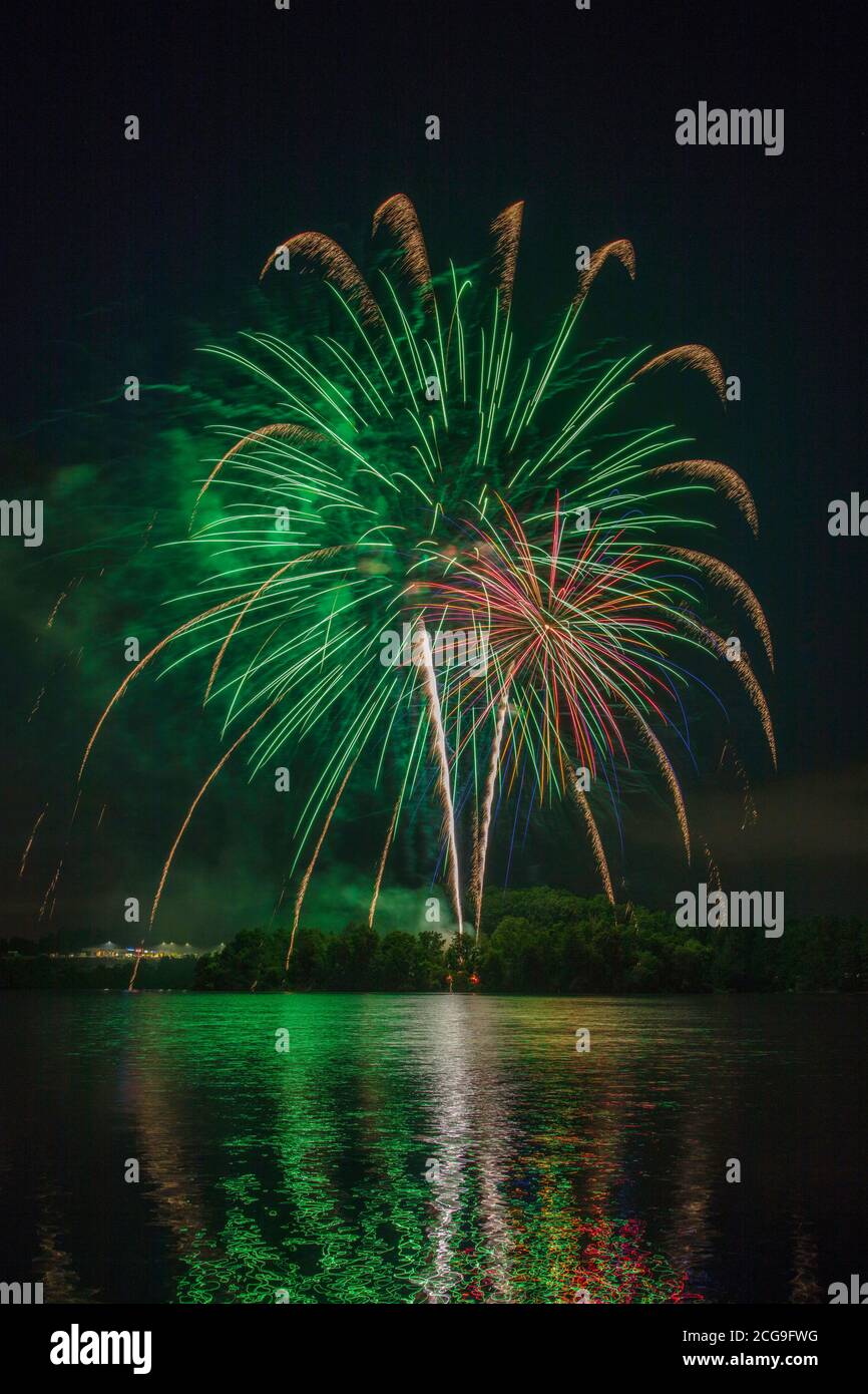 Green burst of fireworks celebration on the 4th of July over Lake