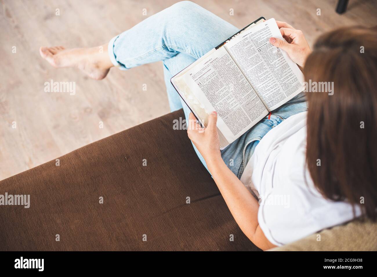 young woman pray with bible relationship with God at home Stock Photo