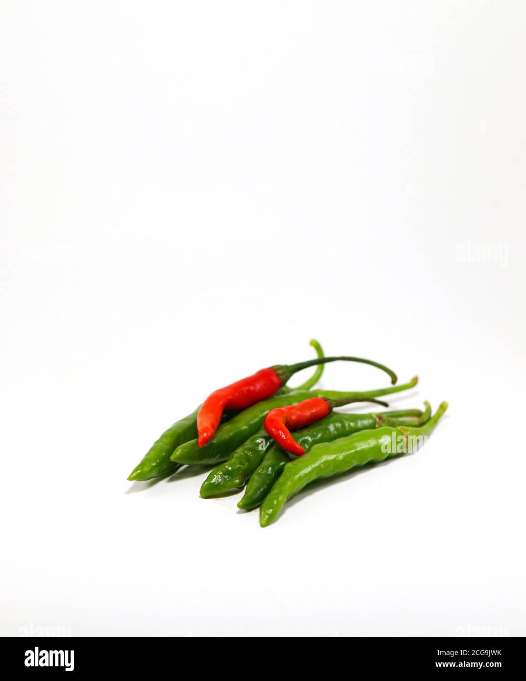 Fresh green peppers and red peppers Isolated on white background Stock ...