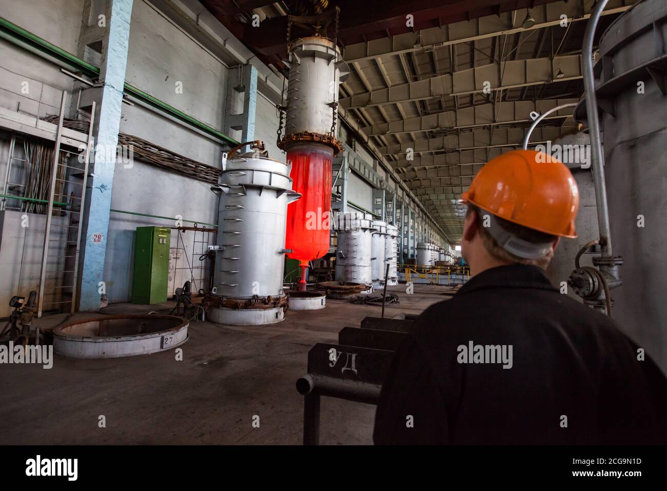 Metallurgist worker watch titanium metal production process. Melting