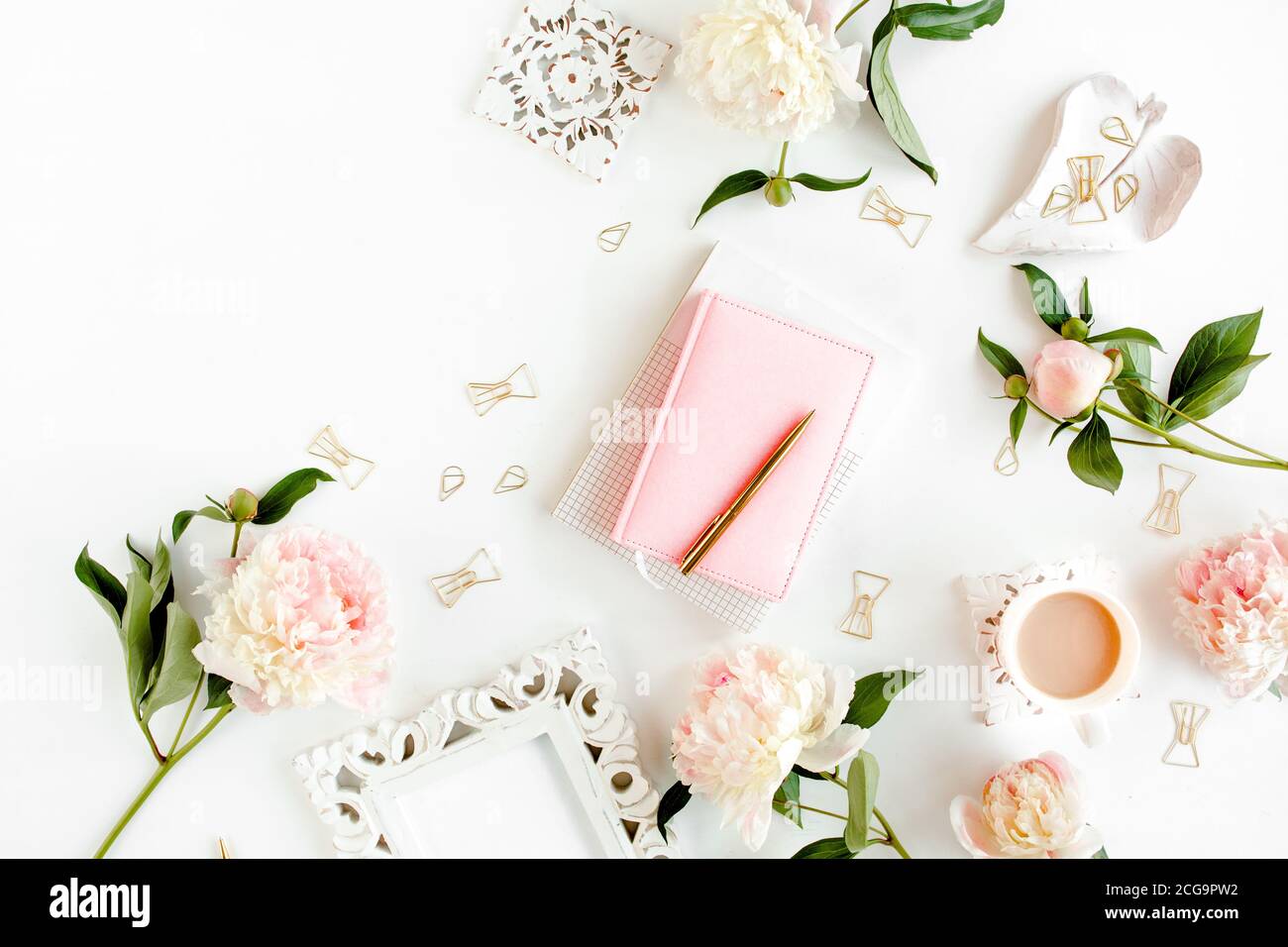 frame made of beautiful pink peonies on wooden white background. Flat ...