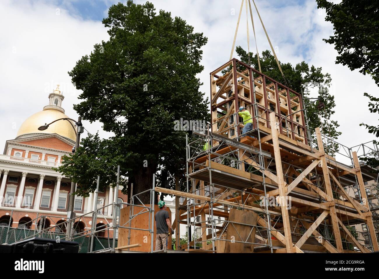 Removal for off site restoration of the historic Shaw 54th Memorial bronze relief outside the Statehouse in Boston, Massachusetts, USA Stock Photo