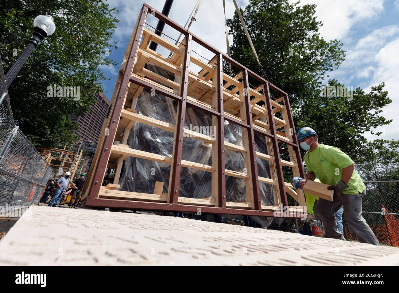 Removal for off site restoration of the historic Shaw 54th Memorial bronze relief outside the Statehouse in Boston, Massachusetts, USA Stock Photo