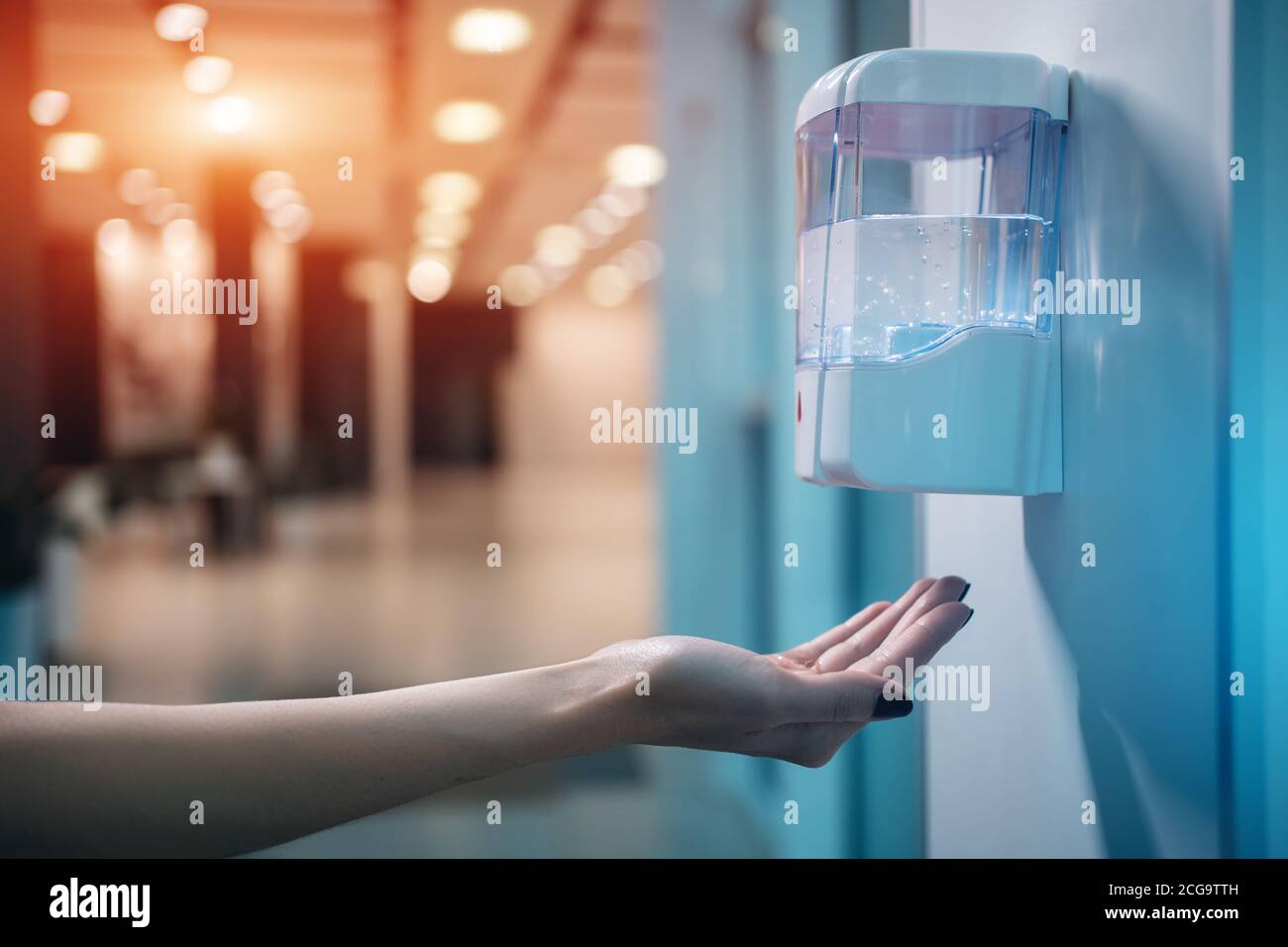 close up of hand use automatic sanitizer with antiseptic for prevention covid 19 Stock Photo