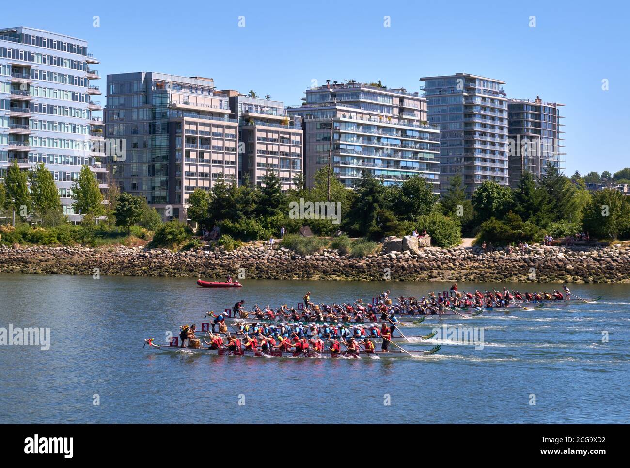 Vancouver, British Columbia, Canada – June 24, 2017. Vancouver Dragon Boat Races. Dragonboat teams race on the calm water of False Creek. British Colu Stock Photo