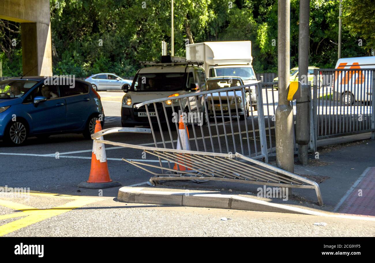 Pontypridd, Wales - June 2018: Damaged metal safety barrier at a road junction caused by a vehicle colliding with it Stock Photo