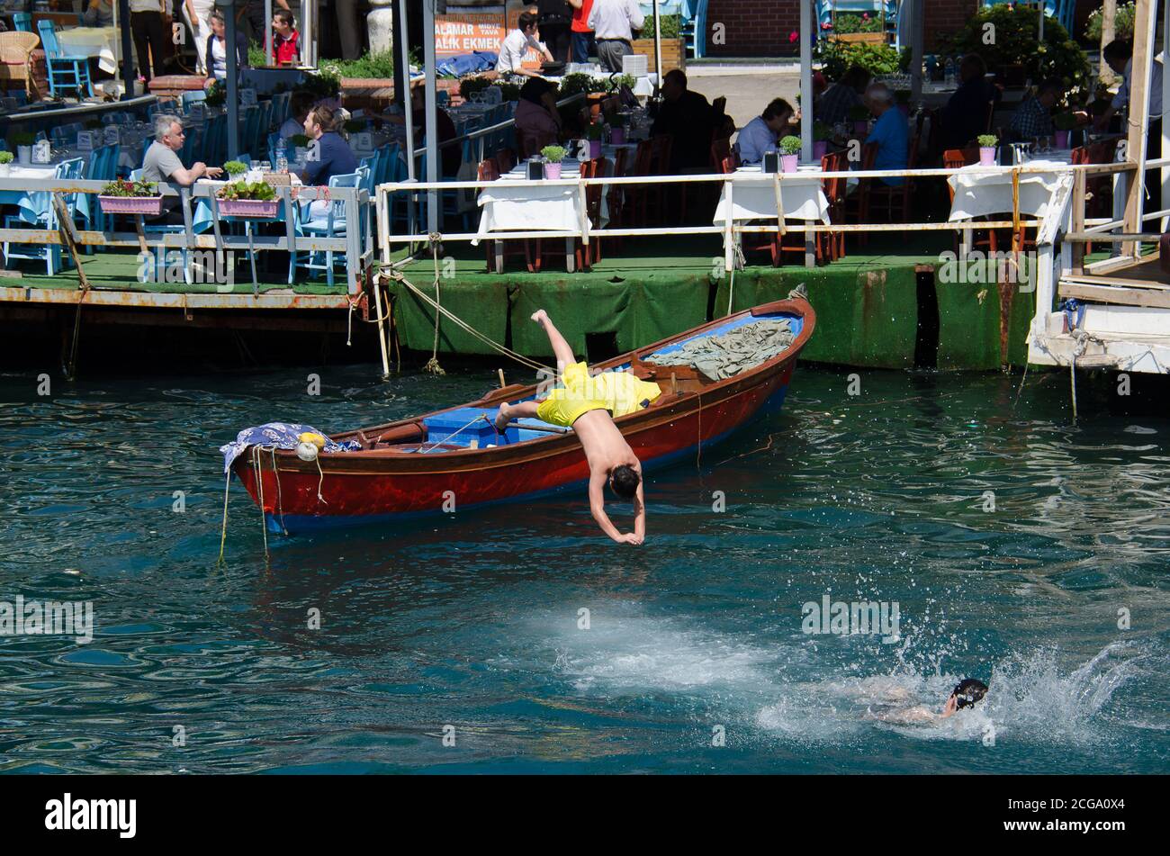 Boy diving off boat in the Aegean coast Turkey Stock Photo Alamy