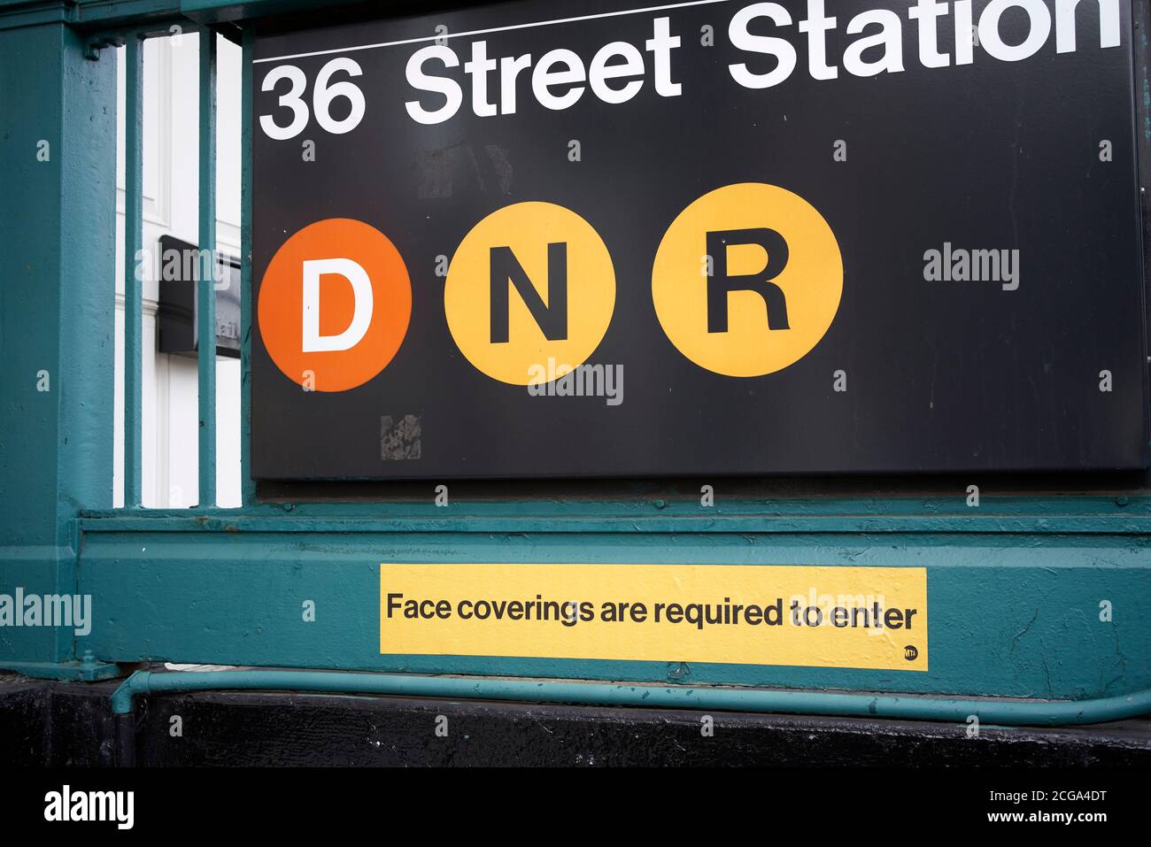 Face coverings are required to enter, covid measure signage in New York City subway. Stock Photo
