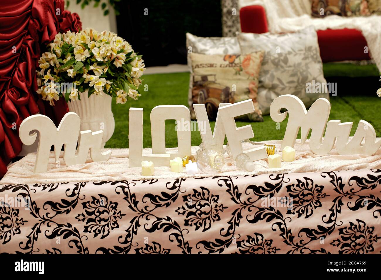 Indoors wedding reception venue with decor, selective focus on flowers Stock Photo
