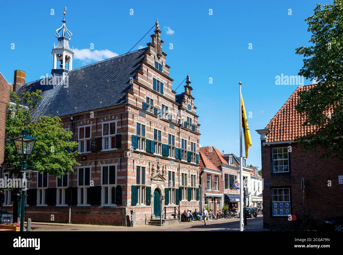 Marktstraat, Naarden historic town centre. Medieval Town hall and sightseeing tourists at the Marktstraat on a sunny day. The Netherlands. Stock Photo