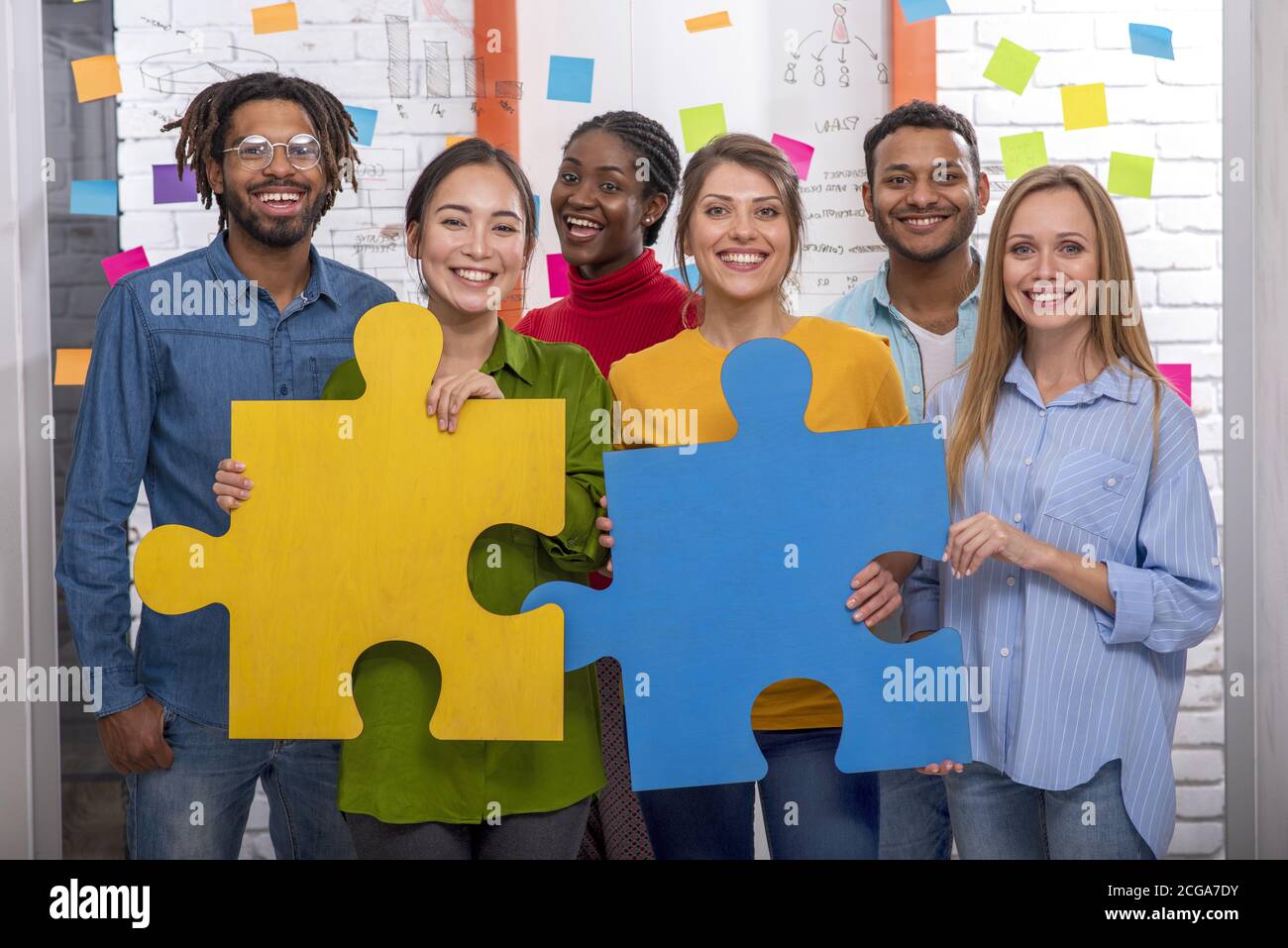 Teamwork of partners. Concept of integration and startup with puzzle pieces Stock Photo