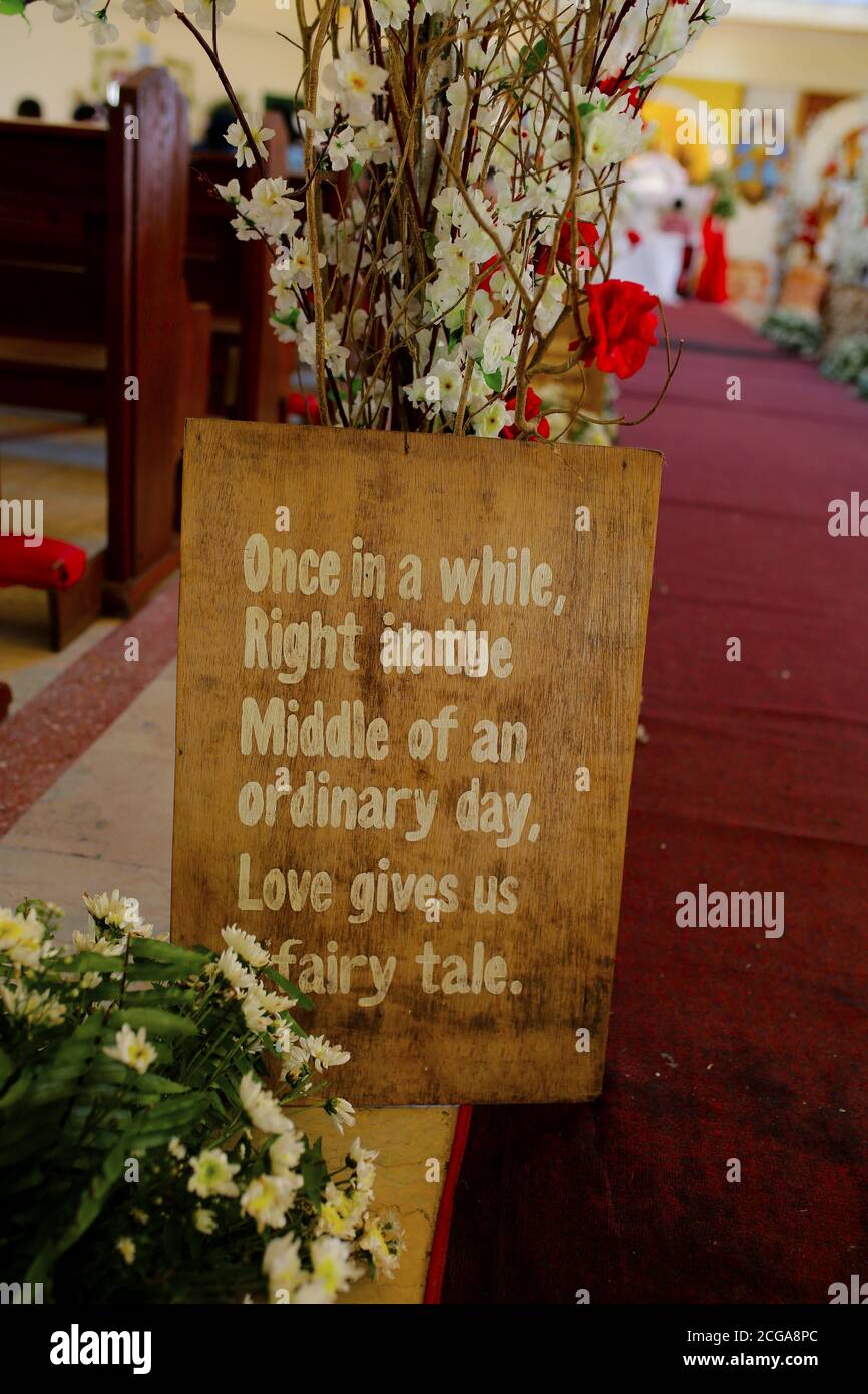 Church wedding interior with rows of elegant chairs and flowing flower