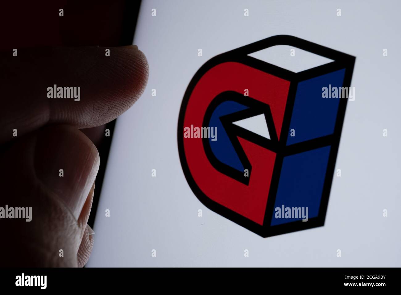 Stone / UK - September 9 2020: Guild Esports gaming company logo on the screen and finger touching it. Selective focus. Concept. Stock Photo