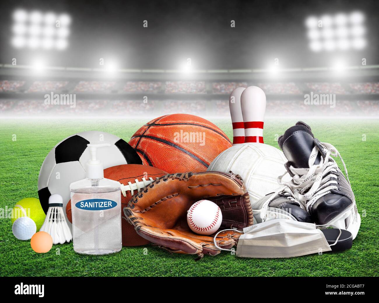 COVID-19 coronavirus new normal and sports concept showing sports equipment, rackets and balls with hand sanitizer and face mask inside stadium and co Stock Photo
