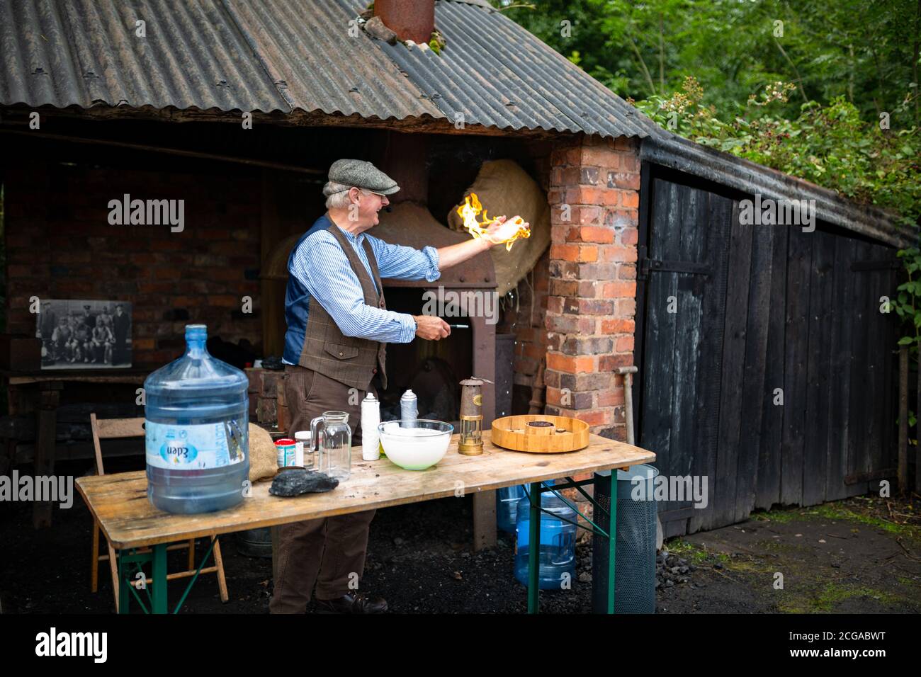 Man demonstrating mine gas safety at the Black Country Living Museum, UK Stock Photo