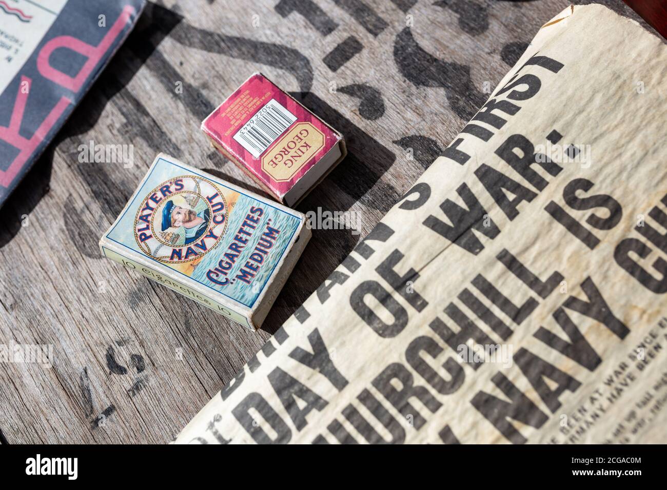 Players Navy Cut cigarettes, matches and old newspapers Stock Photo