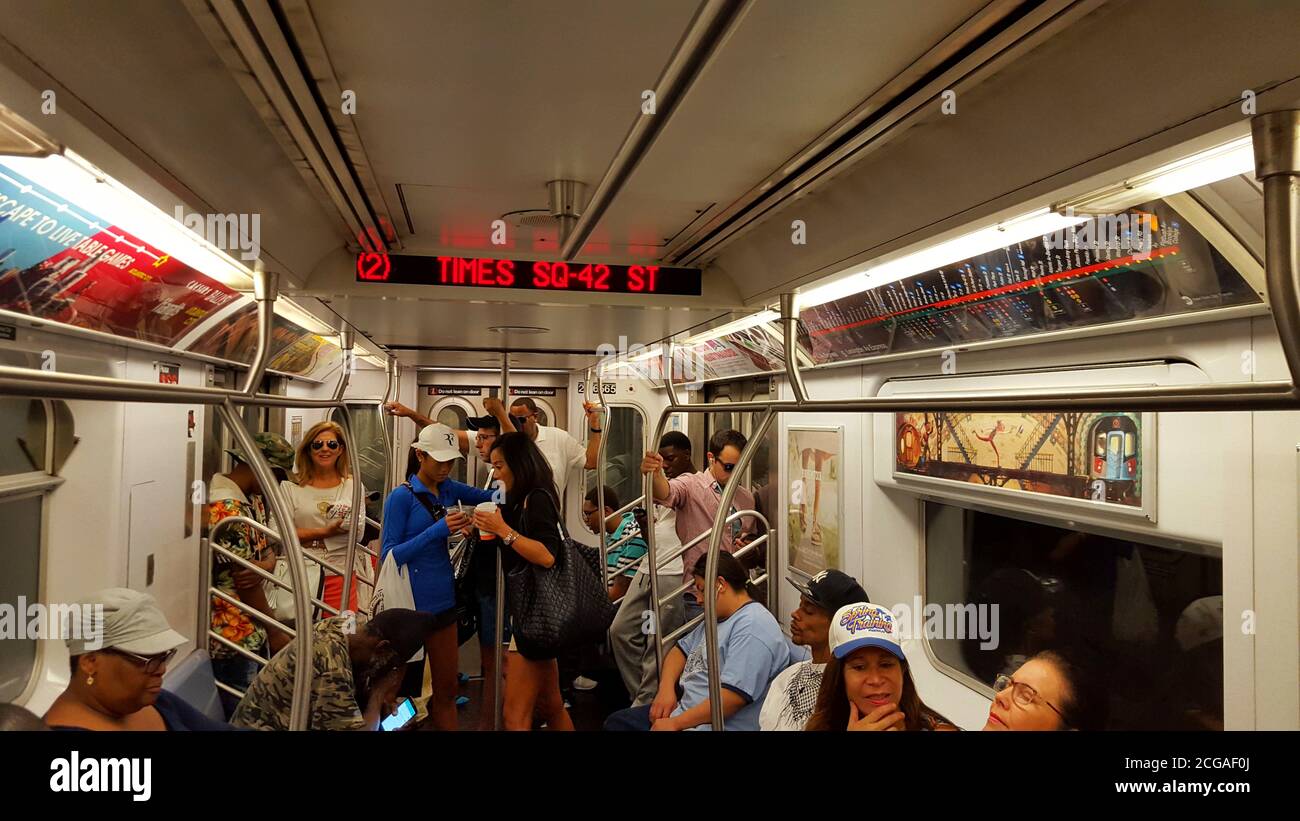 A New York City subway carriage filled with passengers, New York City, United States Stock Photo