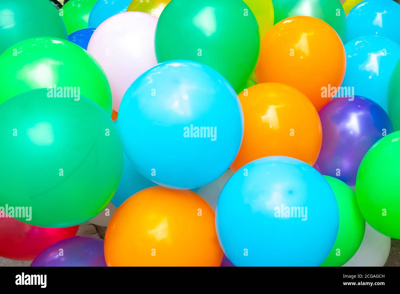 The colored gas filled balloons attached to the yarn are flying