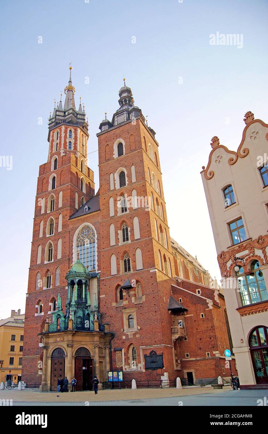 The two-tower gothic St. Marcy Basilica in the old town of Krakow, Poland, completed in 1347, is rich in history and is an icon of the city. Stock Photo