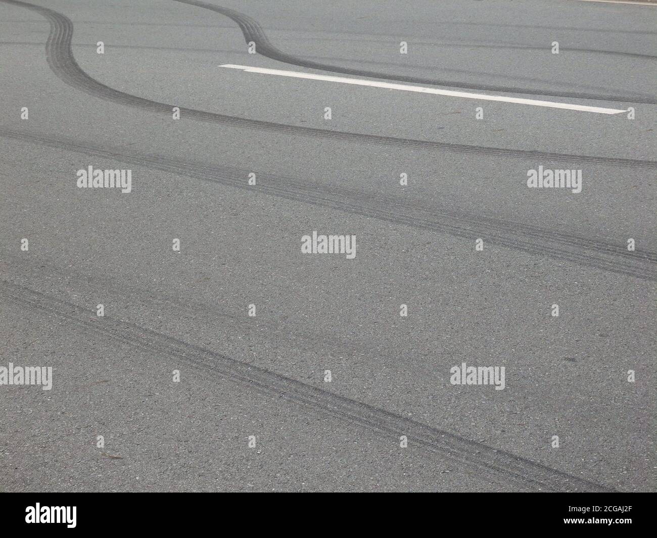 Reckless driving. Car tyre skid marks on a road. Stock Photo