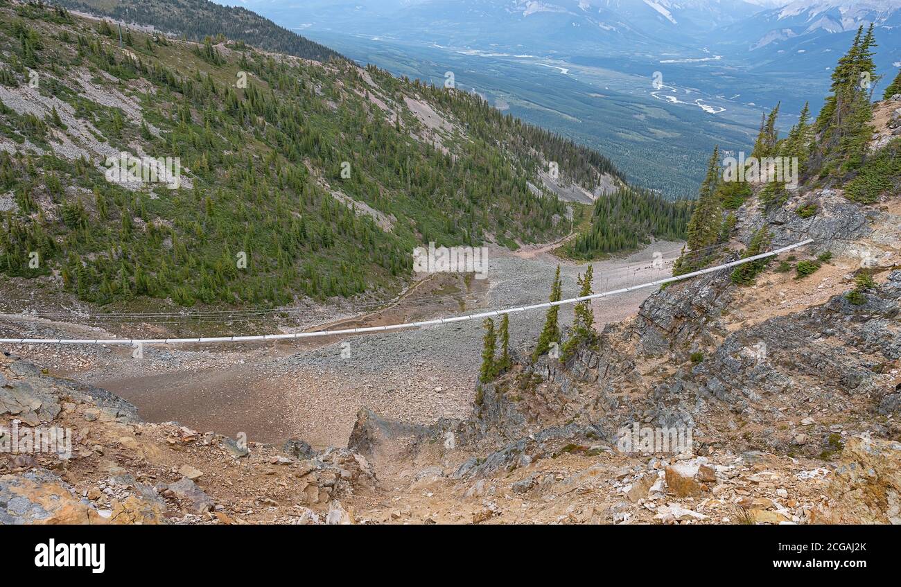 Pedestrian bridge on a mountainside above the town of Golden, British