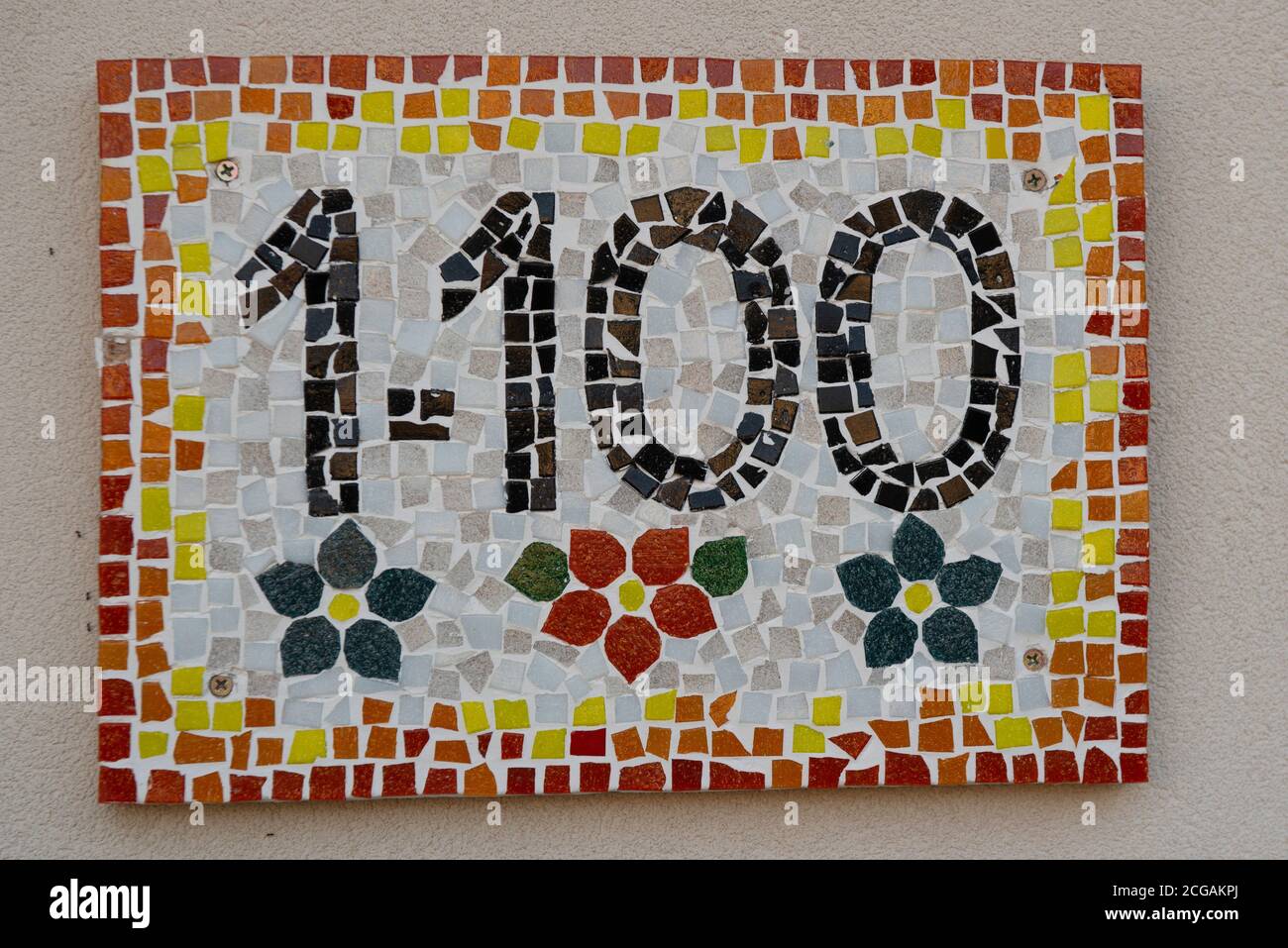 House number one thousand one hundred (1100), handmade mosaic tiles. Stock Photo
