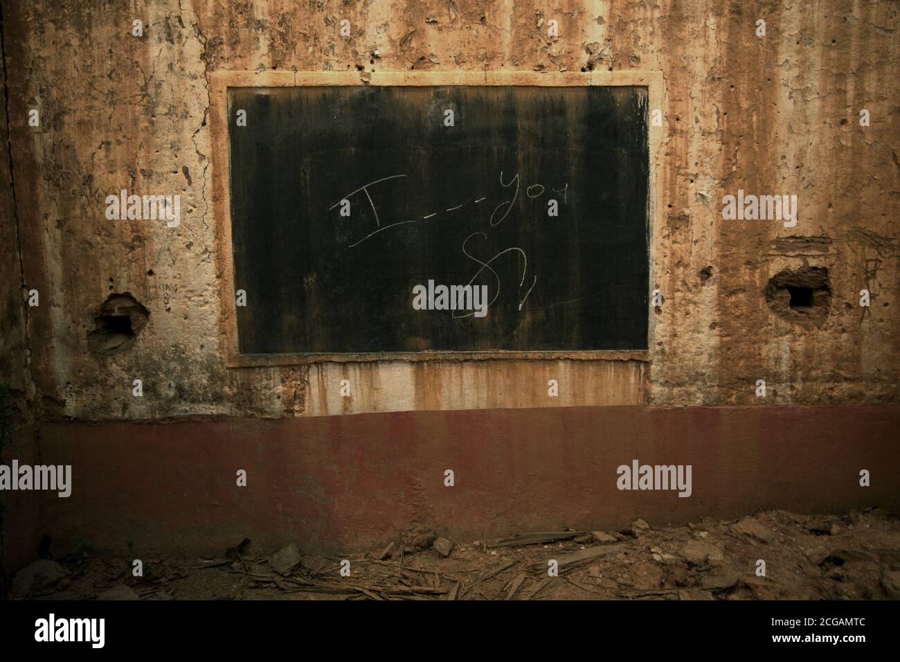 Chalkboard and part of a class room in a school building heavily destroyed by the 2015 earthquakes in Kavrepalanchok district, Bagmati Pradesh, Nepal. Stock Photo