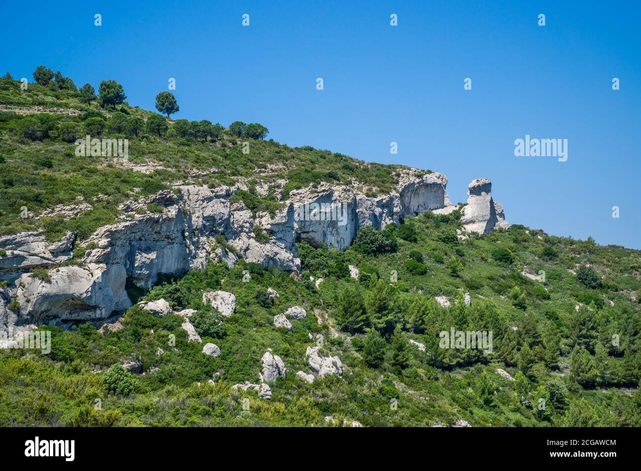 limestone formations with natural bridges on the slopes of the Massif des Calanques in the Calanques National Park along the clifftop road of Route de Stock Photo