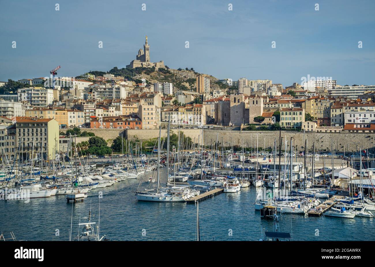 Vieux Port, the Old Port of Marseille with Basilique Notre-Dame de la Garde  in the background on the highest natural point in Marseille, Bouches-du-Rh  Stock Photo - Alamy