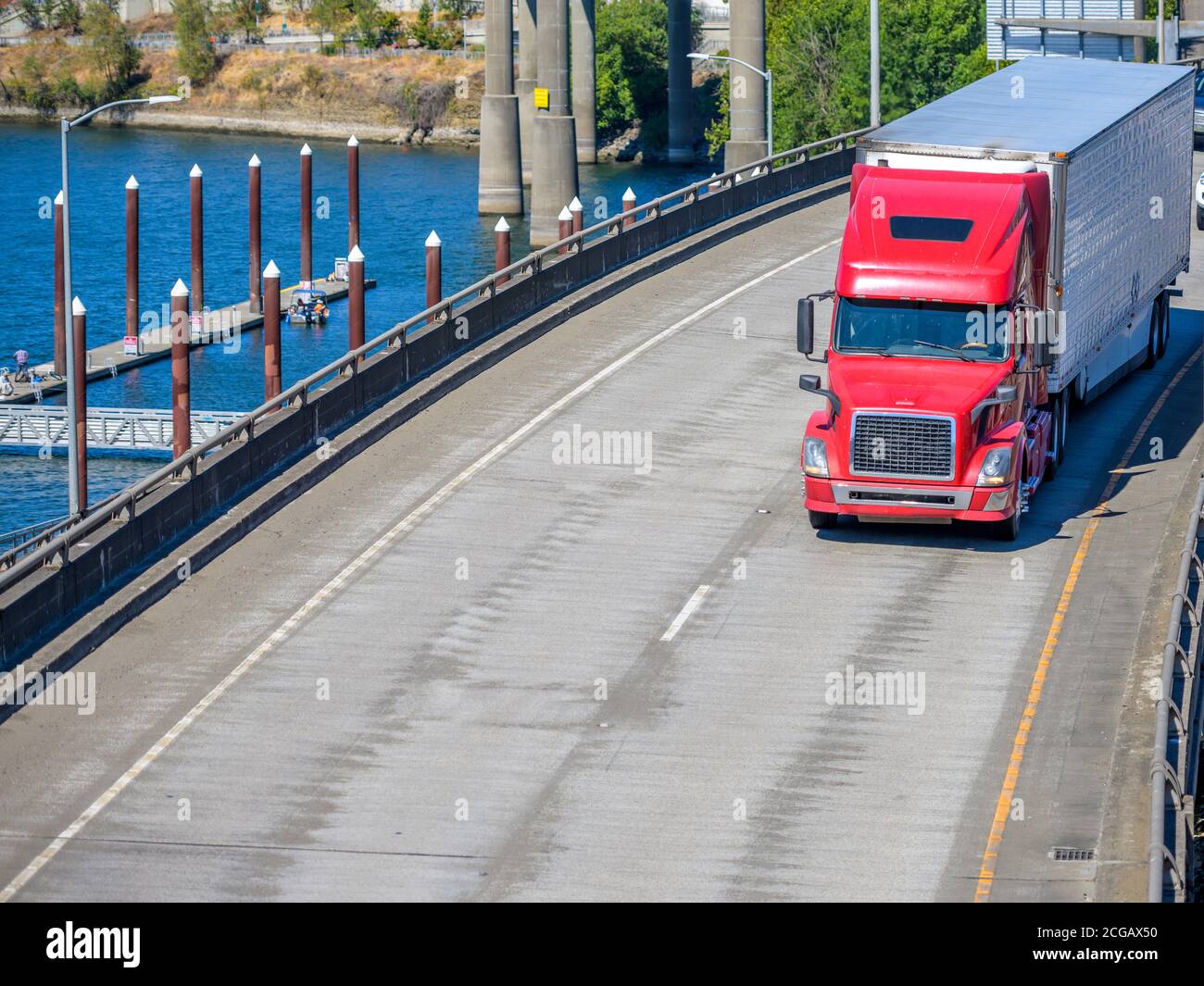 Bright red industrial diesel long haul classic big rig semi truck ...