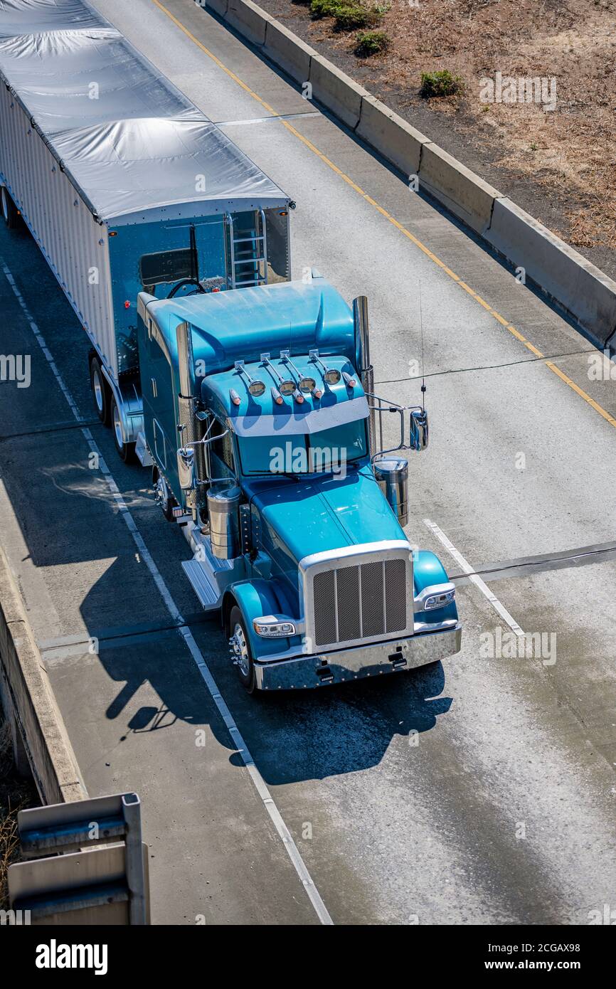 Bright blue industrial diesel long haul classic big rig semi truck ...