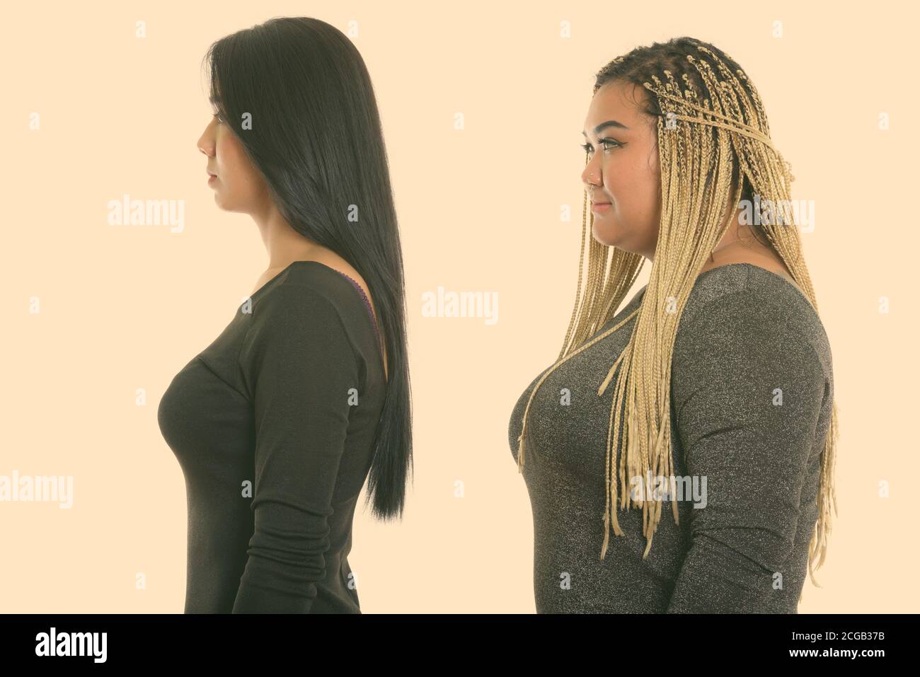 Profile view of young Asian transgender woman and fat Asian woman Stock Photo