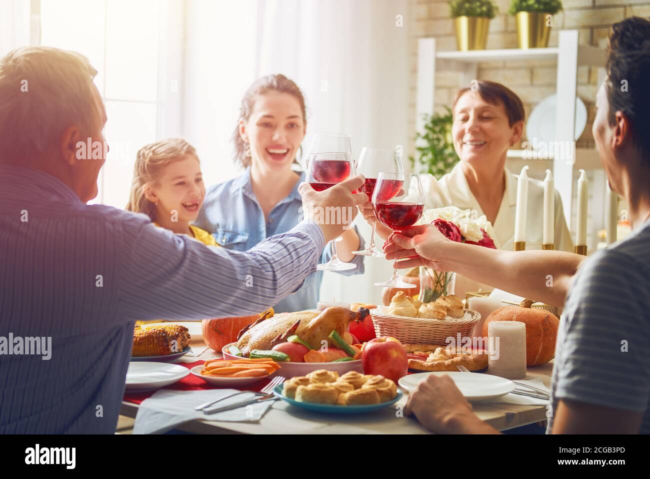 Happy Thanksgiving Day! Autumn feast. Family sitting at the table and